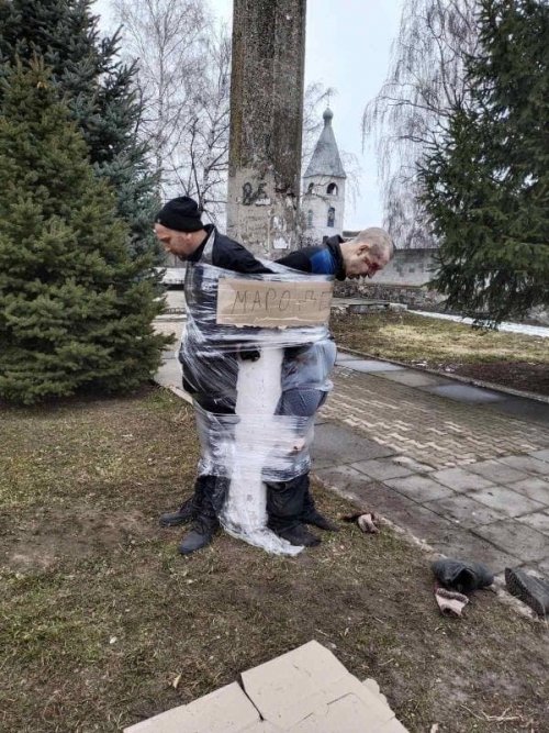 In Ukrainian cities looters are tied to poles with food foil.